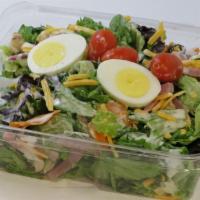 Chef Salad · Entrée size! Ham and turkey with olives, cheese, tomato, and boiled egg on a bed of mixed gr...