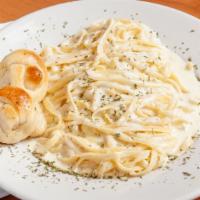 Fettuccine Alfredo · Fresh fettuccine tossed with butter and creamy Parmesan cheese sauce.