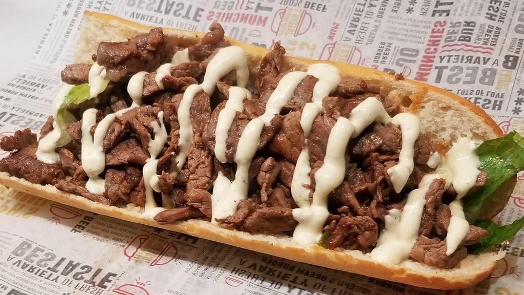 Philly Style Steak Sandwich · Extremely Lean Rib eye  cut up Served on a baguette. Served with choice of  lettuce, tomato, onion, pickles, and your choice of sauce.