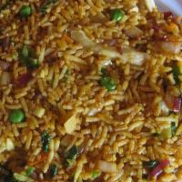 Vegetable Masala Fried Rice · Rice stir-fried with vegetables, Indian spices and lots of fresh coriander.