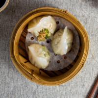Give Me The Dumpling Life · Juice tender pork stuffed in dumpling skin and steamed to perfection.