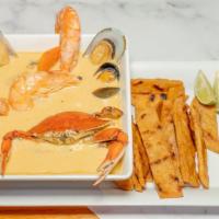 Mariscada Salvadoreña · Salvadoran seafood soup in special cream. Clams, fish, crab, green mussel, calamari, shrimp ...