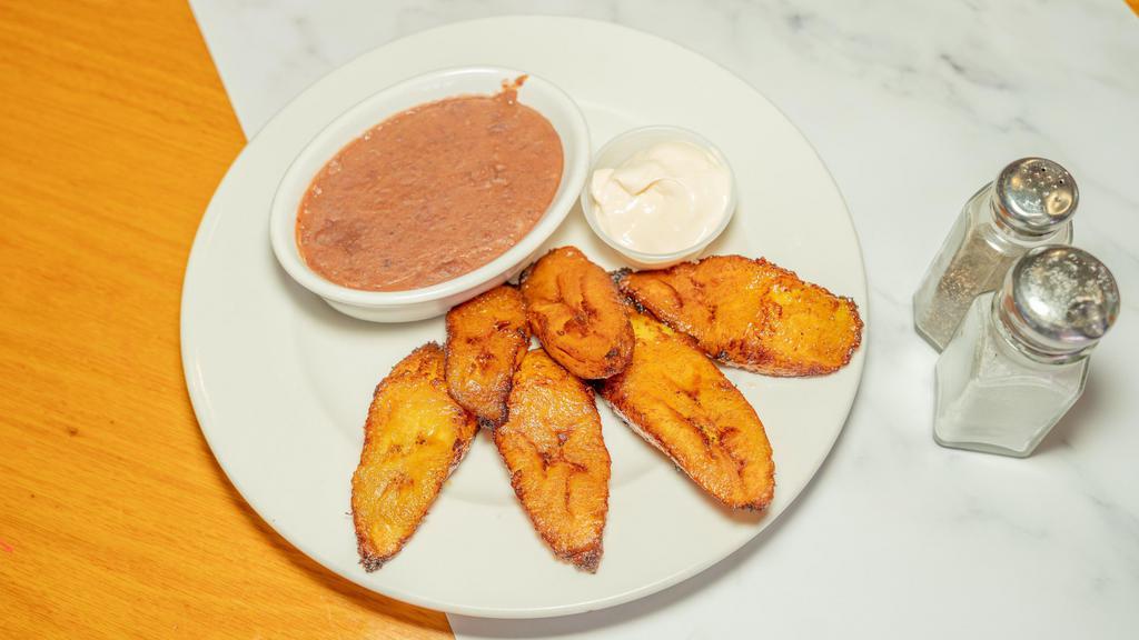 Platanos Fritos (#46) · Fried plantain served with sour cream and refried salvadorans beans.