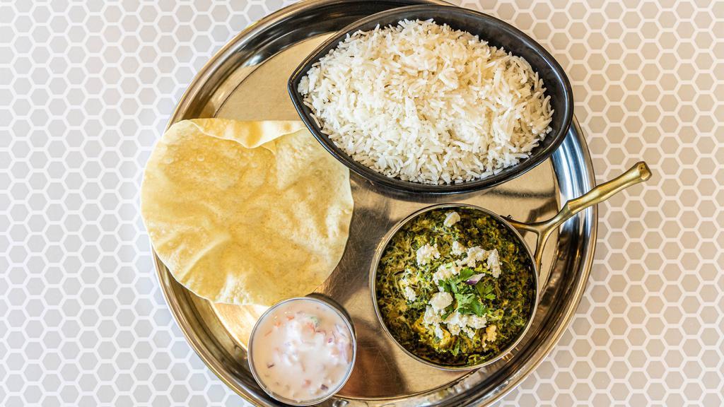 Saag Paneer · Homemade cheese simmered in spinach-based gravy and Indian spices.