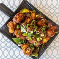 Gobi Manchurian · Cauliflower florets coated, deep fried and sauteed with onion, bell peppers, garlic, chili a...