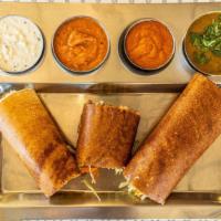 Madras Spring Dosa · Rice crepe spread with a spicy Mysore chutney, stuffed with potato masala and mixed crunchy ...