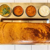Paper Ghee Roast · A crispy, thin and long, buttery rice crepe.