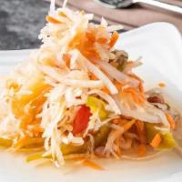 Atchara · pickled papaya with carrots, onions, peppers, pineapple and raisins