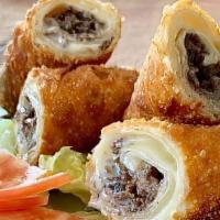 Cheesesteak Egg Rolls · Two house made cheesesteak egg rolls deep fried to perfection. Made with rib eye steak.