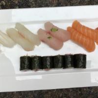 Sushi Deluxe (9) · Assorted sliced raw fish on vinegared rice. Sushi and one tuna roll.