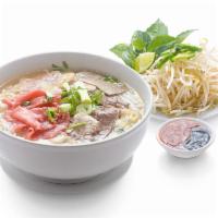 Pho Tai Chin Nam Gau Gan · Beef noodle soup with rare steak, wellson brisket, flank, fatty brisket and tendon