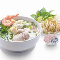 Mi Hai Duong (Nuoc) · Hai duong style egg noodle soup pork, shrimp. Squid, fish ball. Quail eggs. Pork's heart and...