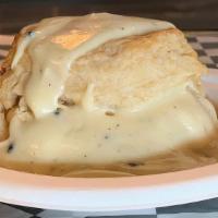 Biscuits And Gravy · Our fresh biscuits covered in our delicious pepper gravy and your choice of breakfast meat.