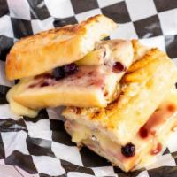 Brie On Baguette · Our house made blueberry bourbon sauce with creamy fresh brie melted on a baguette that we b...