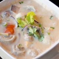 Tom Kha  · Thai hot and sour soup with mushroom, red onion,. tomato, lemongrass, galangal and kaffir li...