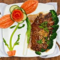 Garlic Duck · Half boneless roasted duck on bed of steamed cabbage, carrot and broccoli. Served with garli...