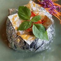 Baked Creamy Curry Seafood · Combination seafood cooked in creamy red curry.. Served on steamed cabbage and carrot in tin...