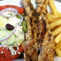 Chicken Souvlaki Platter · Marinated cubes of chicken, served with Greek salad, French fries, pita bread, and tzatziki ...