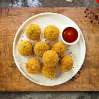 Mac And Cheese Balls · (Vegetarian) Bite-size clumps of mac and cheese breaded and fried until golden brown.