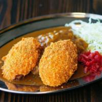 Potato Croquette With Curry (Vegan) · A  delicious fried  panko-crumbed mashed potato with curry sauce served over rice