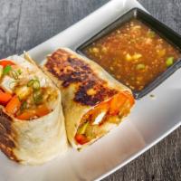General Tso Chicken Burrito · Sweet and spicy with a tang. Served with carrots, scallions and bell peppers!