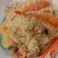 Poke Bowl E · Rice w. avocado, seaweed salad, kani, salmon, tuna, shrimp w. spicy mayo, masago and crunch.