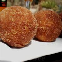 Mashed Potato Ball · Mashed potatoes baked until crispy with a cheesy filling. (Vegetarian)