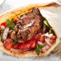Kefta Wrap · Minced seasoned beef wrapped with tomatoes, onions,hummos,and pickles.