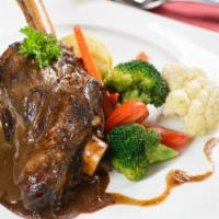 Lamb Shank Platter · Braised leg of lamb served with  3 sides