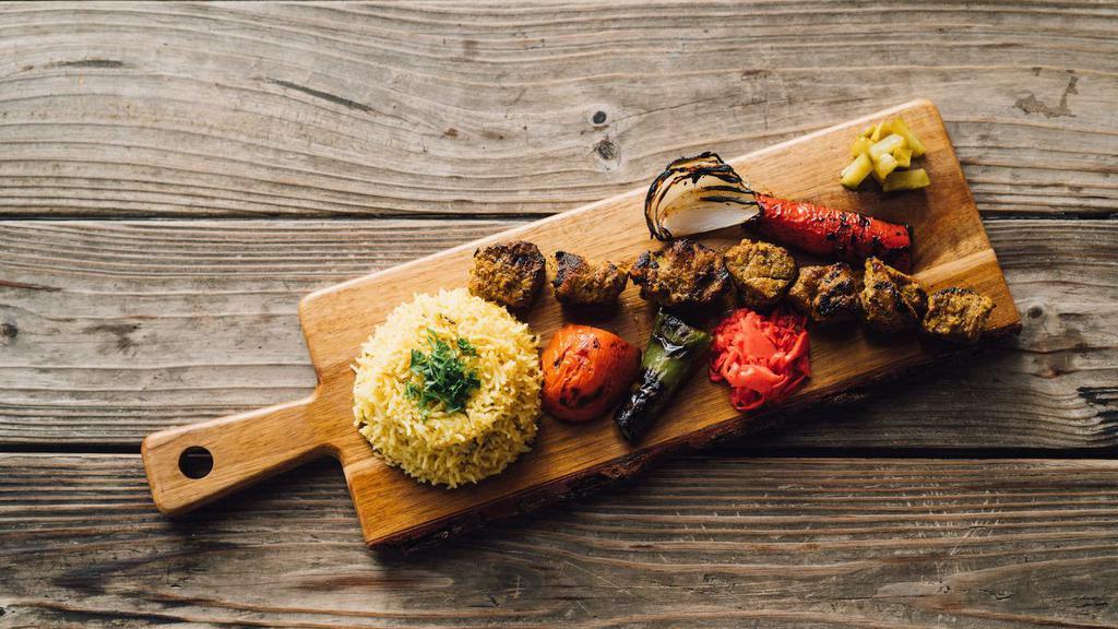 Lamb Kabob Platter · char grilled pea of boneless lamb served with 3 sides