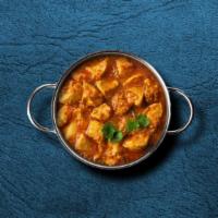 United Chicken Curry  · Marinated chicken stewed in an onion- and tomato-based gravy, flavored with ginger, garlic, ...