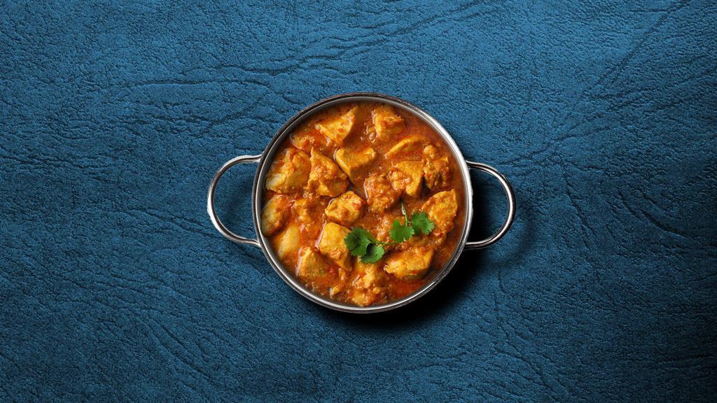 United Chicken Curry  · Marinated chicken stewed in an onion- and tomato-based gravy, flavored with ginger, garlic, chili peppers, and a variety of spices. Served with a side of aromatic white rice.