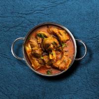 United Goat Curry · Marinated goat stewed in an onion- and tomato-based gravy, flavored with ginger, garlic, chi...