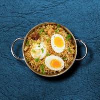United Egg Biryani · Long-grained rice dish loaded with boiled eggs, caramelized onions and fresh herbs, homemade...