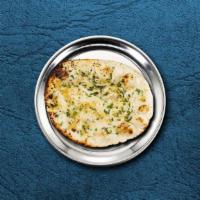 Garlic Naan Bread · A refined flour leavened flatbread pressed with minced garlic and baked over an Indian clay ...