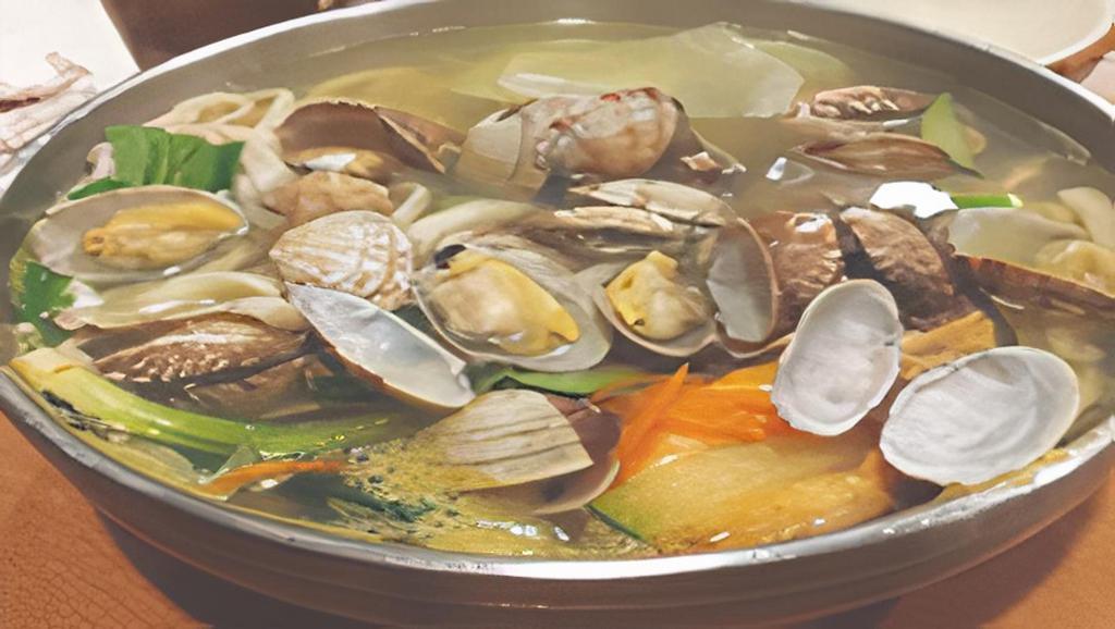 Jogae Sujebi Tang · Clam soup with flat noodle.