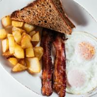 Easy Living · Two eggs any style, choice of sausage or bacon, breakfast potatoes, choice of toast.