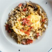 Chilaquiles · Appaloosa beans, roasted tomatillo salsa, pepper jack chesse, fried corn tortillas, fried egg.
