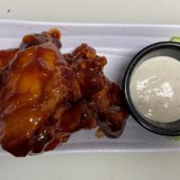 Sauced And Tossed · Crispy chicken wings tossed in your choice of sauce(hot, mild, teriyaki ginger, bbq)