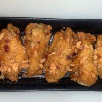Vin'S Sweet Chicks · Crispy chicken wings smothered in honey, seasoned with salt and cayenne pepper, and topped w...