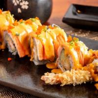 Christmas Roll · Shrimp tempura, cucumber, topped with kani, caviar, scallion, and spicy mayo sauce.