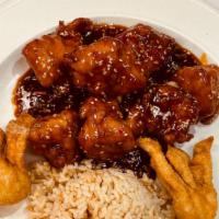 Sesame Chicken · Lightly breaded chunks of tender chicken sautéed in sweet & spicy tangy sauce.
