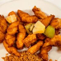 Sweet & Sour Chicken · Breaded chicken fried to golden brown, topped with pineapple, kiwi, sweet & sour sauce on th...