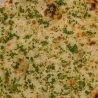 Garlic Naan · Leavened homemade bread baked in a clay oven with garlic, Cilantro and butter.