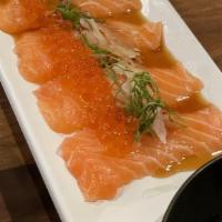 Salmon Carpaccio · Fresh salmon sashimi, salmon egg, white onions, green onions and shiso leaves with citric yu...