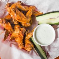 Hot Wings · A large basket of original, bbq or hot pepper wings served with zucchini spears and ranch.