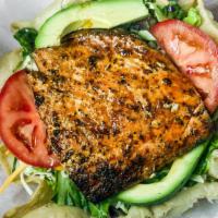 Mesquite Salmon Salad · Mesquite grilled salmon served on a bed of crisp romaine with cabbage salad, cheese, tomatoe...