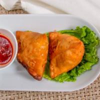 Samosa (2 Pcs) · Pastry stuffed with potato, peas, onions cooked in aromatic spices, served with green sauce
