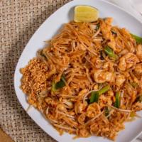 Pad Thai · Stir-fried rice noodles with eggs, bean sprouts and green onions, served with crushed peanut...