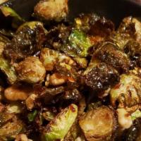 Brussel Sprouts · Vegetarian, nuts. Fried & tossed with walnuts, garlic, honey, chili flake.